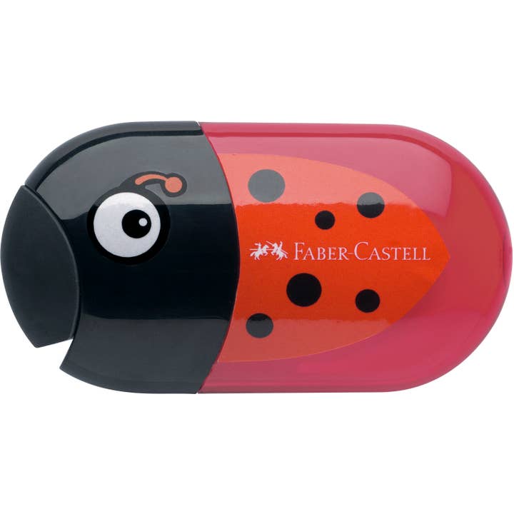 Pencil sharpener in a black and red ladybug design showing the eraser that serves as a cover for the two holes of the sharpener