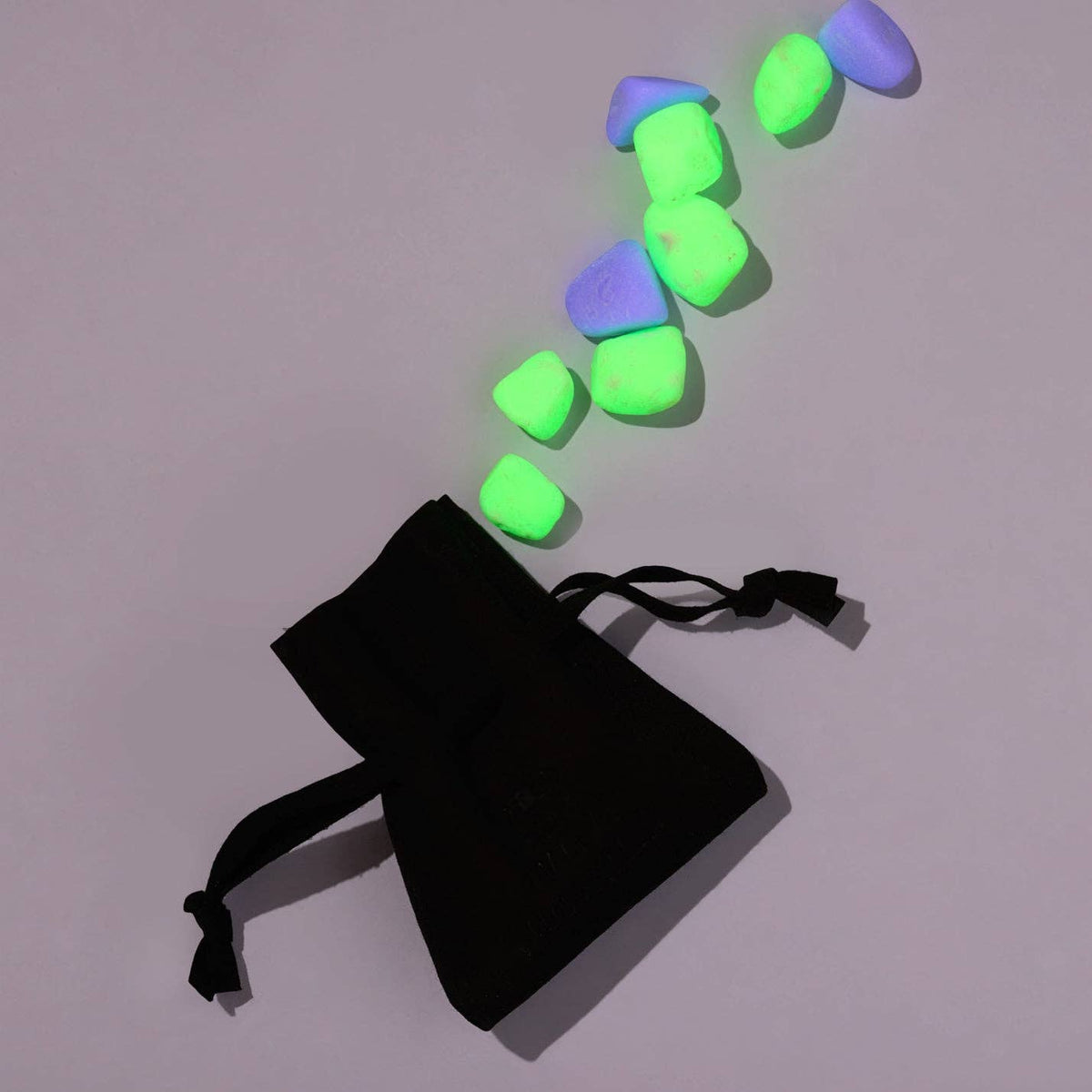 green and purple glow pebbles and carrying pouch