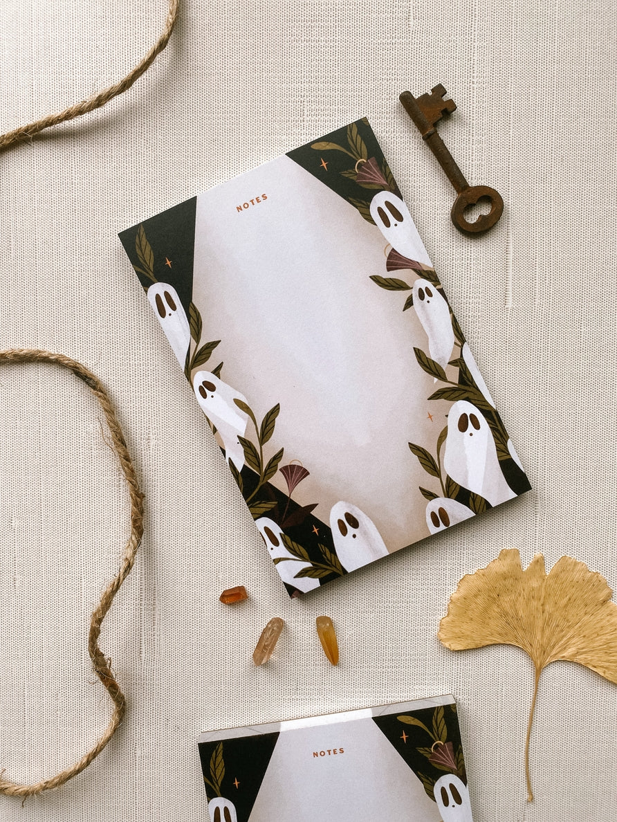 Notepad with "notes" written at top, with a border of ghosts and moonflowers