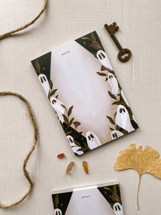 Notepad with "notes" written at top, with a border of ghosts and moonflowers