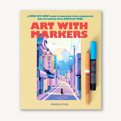 Book titled 'Art with Markers' by Angela Pan with a pastel landscape painting and two acrylic paint markers on a white background