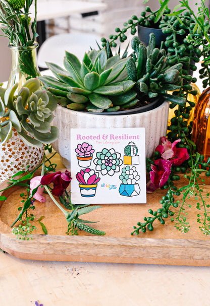the cover of the Rooted and Resilient book with five different succulent type plants leaning against a variety of houseplants