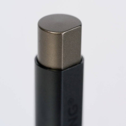 Detail of the gunmetal colored retraction button on top of the Blackwing pen