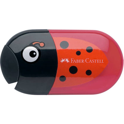Pencil sharpener in a black and red ladybug design showing the eraser that serves as a cover for the two holes of the sharpener