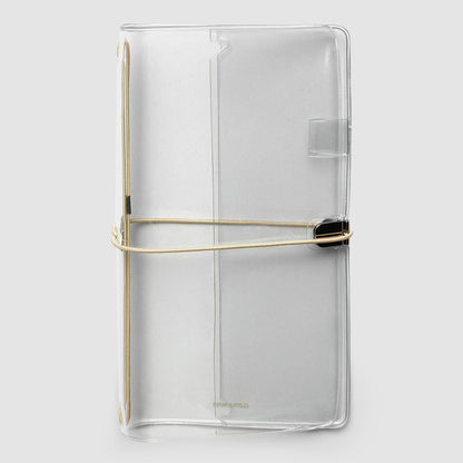 Cloth & Paper's A5 Slim clear vinyl planner cover with a beige elastic band closure and a small black accent, shown on a light gray background.