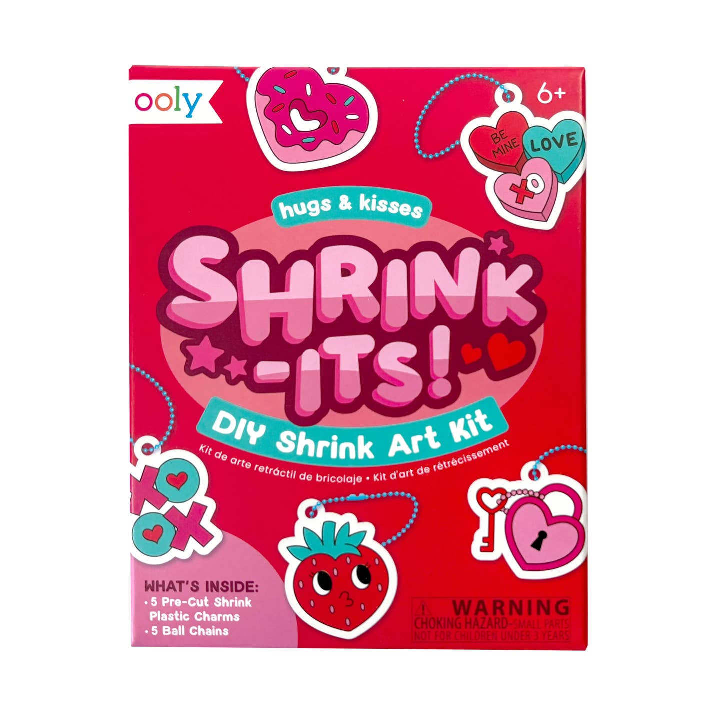 Shrink-Its DIY Shrink Art Kit packaging with pink background and colorful shrink it charms on key chains like heart shaped donuts, xoxo, strawberries, and hearts.