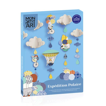 Mon Petit Ari craft kit packaging box titled 'Expédition Polaire' Polar Expedition on a clean white background. The box features a light blue cover decorated with whimsical paper-cut style polar-themed illustrations including polar bears, polar bears in hot air balloons, polar bears in snowmobiles, polar bears in kayaks, polar bears in canoes, polar bears in snowmobiles, polar bears in canoes, polar bears in snowmobiles, and polar bears in canoes.