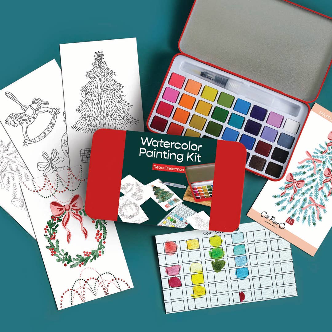 Retro Christmas watercolor painting kit arranged on a teal background, including a red metal paint box with multiple color pans, several Christmas-themed coloring pages, a palette sheet, and a small brush. The set is styled as a flat lay with no person or real environment.