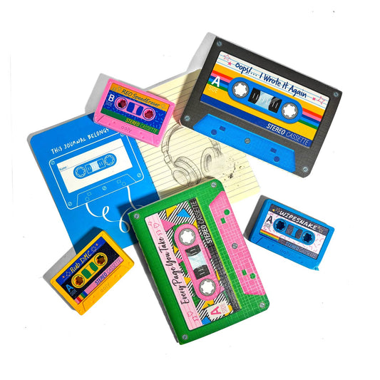 Ooly Rewind Cassette Tape Erasers and Notebooks. One notebook is open to show the lined pages. 