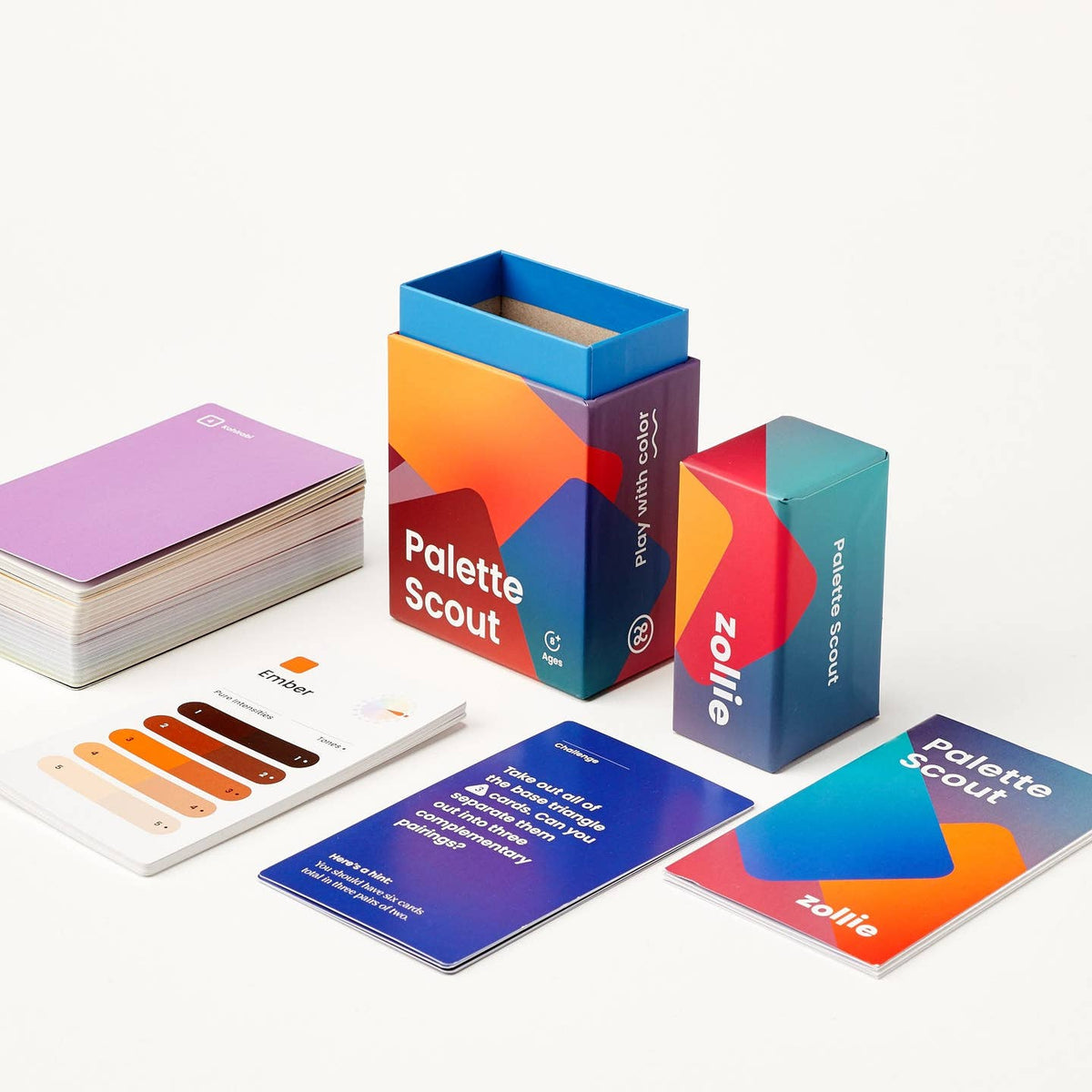 Palette Scout deck laid out with hint cards, instructional booklet, and retail packaging