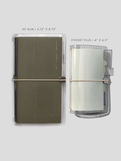 The two sizes of the Cloth & Paper clear vinyl covers shown side by side with notebooks inside
