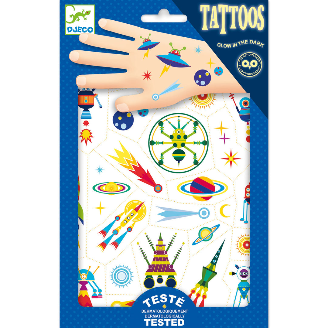 blue package of temporary tattoos showing a variety of space themed tattoos, like rockets and alien ships, on a cartoon hand