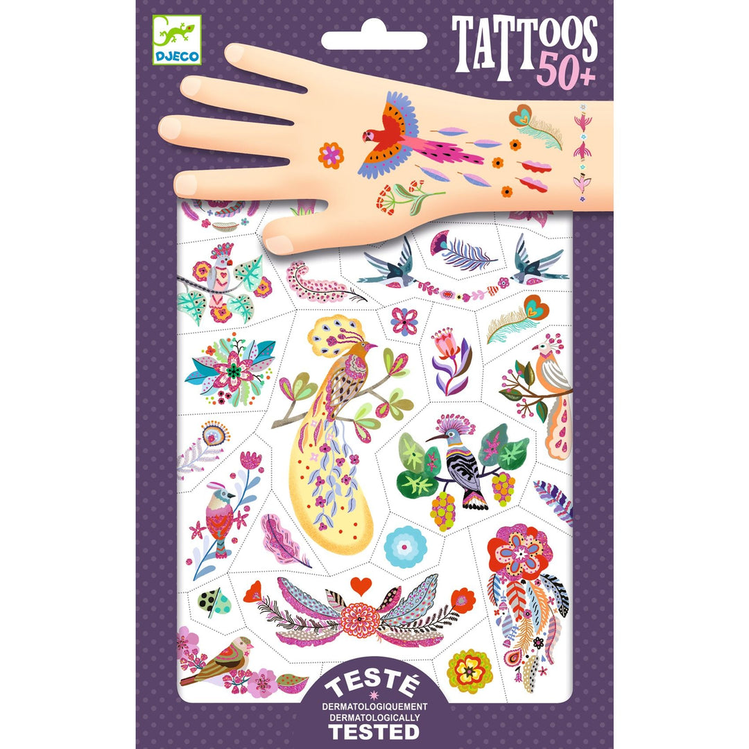 purple package of temporary tattoos showing a variety of bird themed tattoos, like birds in flight, on trees, or graphic feather designs, some are shown on a cartoon hand