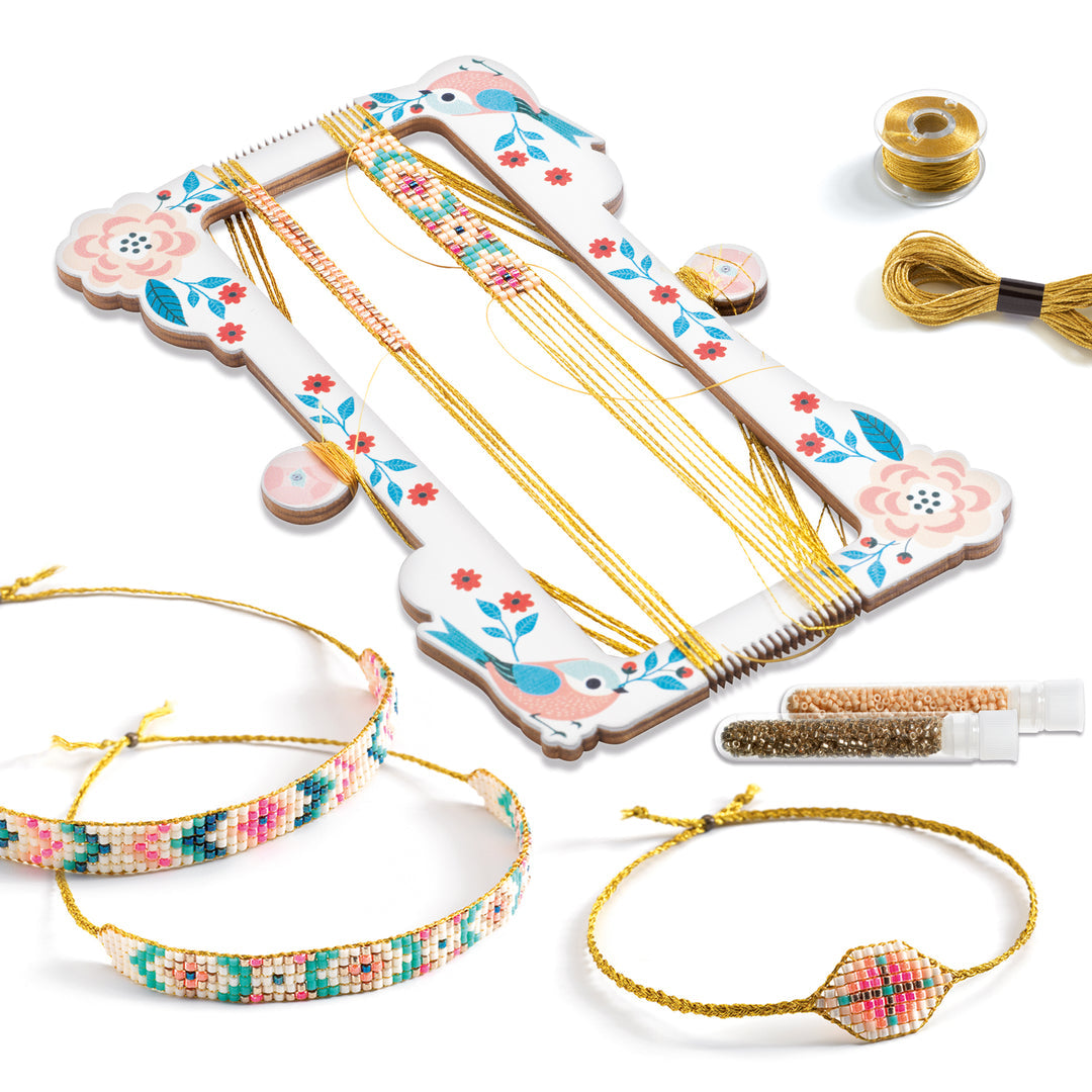 Bracelet-making loom with tools and materials on a white background