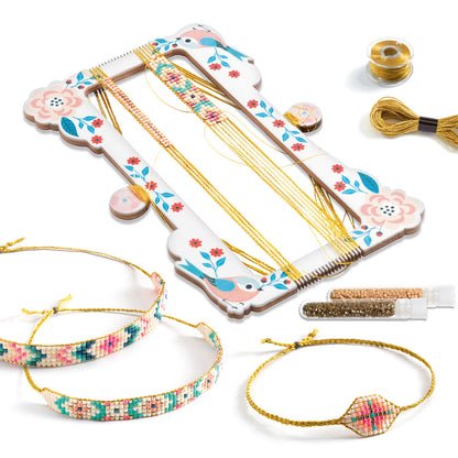 Bracelet-making loom with tools and materials on a white background