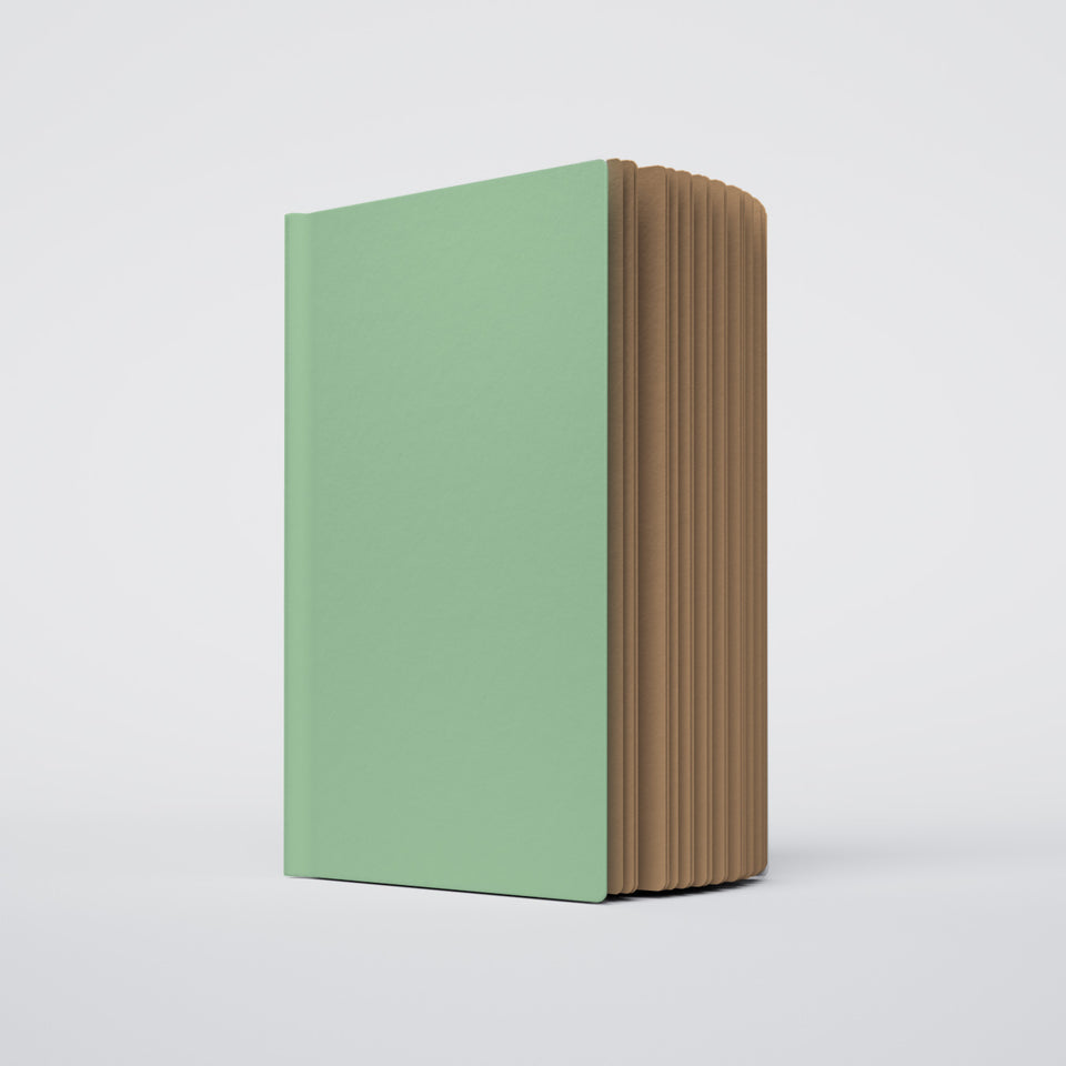 a partially open ugly book with a mint green cover and kraft brown interior pages