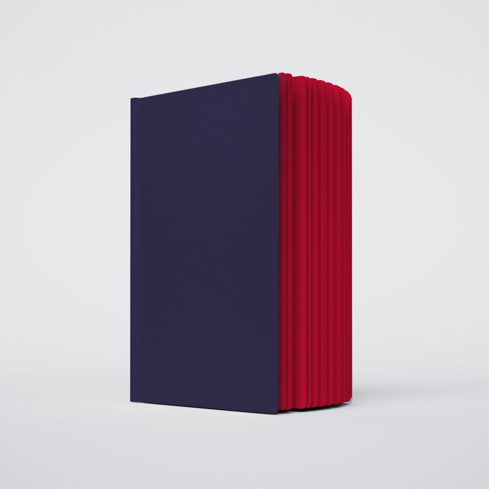 a partially open ugly book with a deep navy purple cover and red interior pages