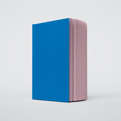 Uglybook in No 1 Pluto with a bright blue cover and soft lavender pages