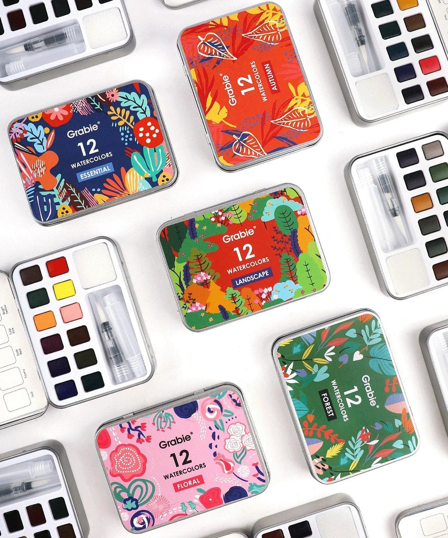 Layflat image of a variety of Grabie 12 Color Pocket Watercolor sets