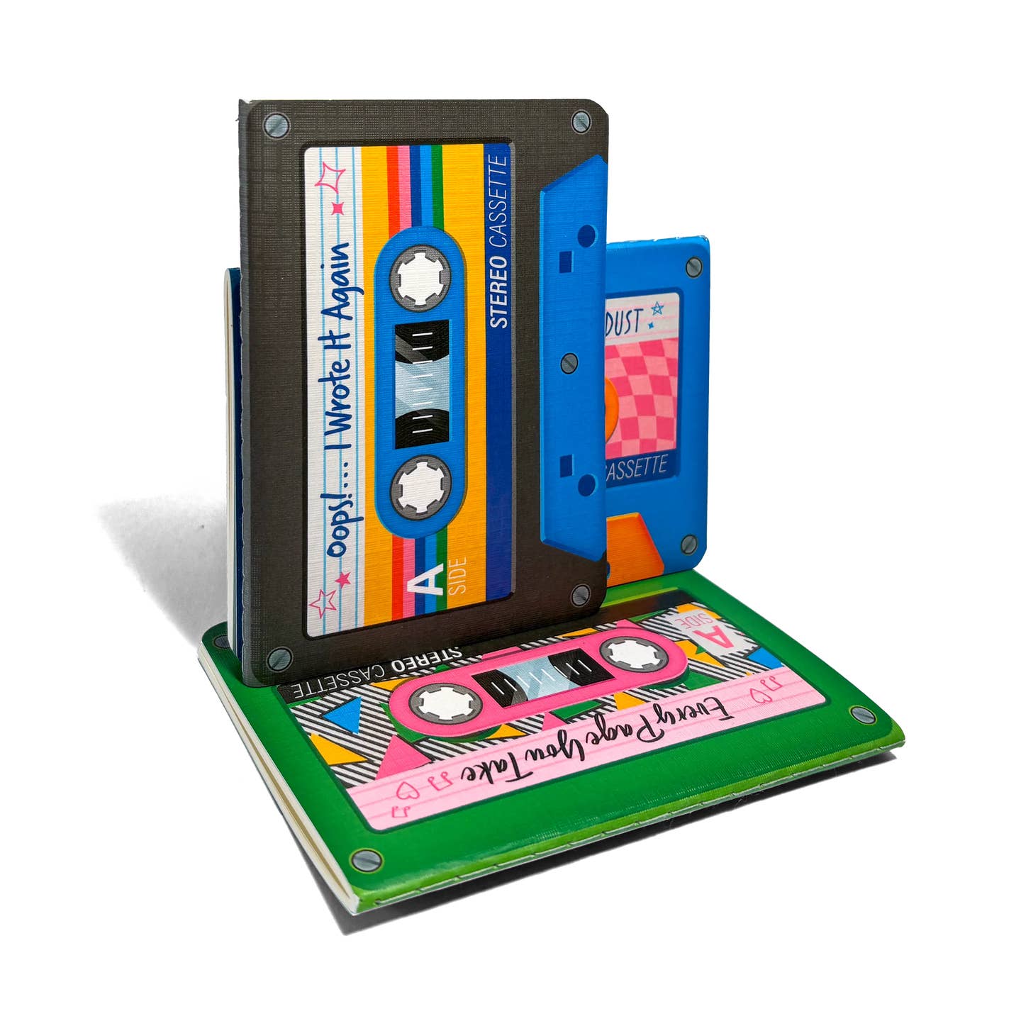 Three novelty cassette tape notebooks one in black, blue, and green