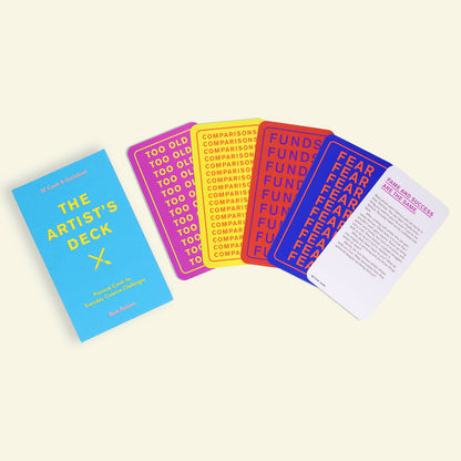 Collection of colorful cards that read "too old" "comparisons" "funds" and "fear" with brightly colored text on a light beige background
