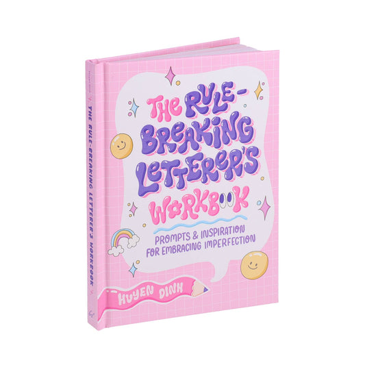 Pink book titled 'The Rule-Breaking Letterer's Workbook: Prompts & Inspiration for Embracing Imperfection' in lavender and pink bubble letters on a white background