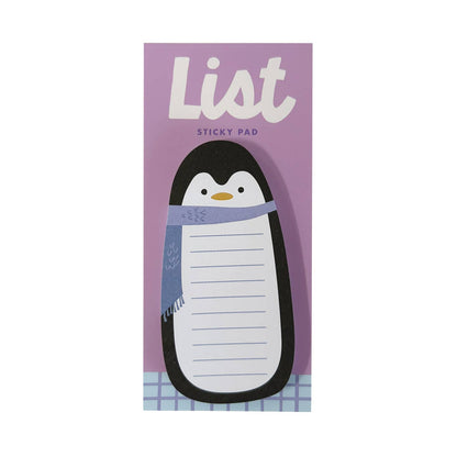 A penguin-shaped sticky pad on a lavender card that reads 'List Sticky Pad.' The pad is white with blue lined writing sections, and the penguin has a black body, white belly, and a light blue scarf.