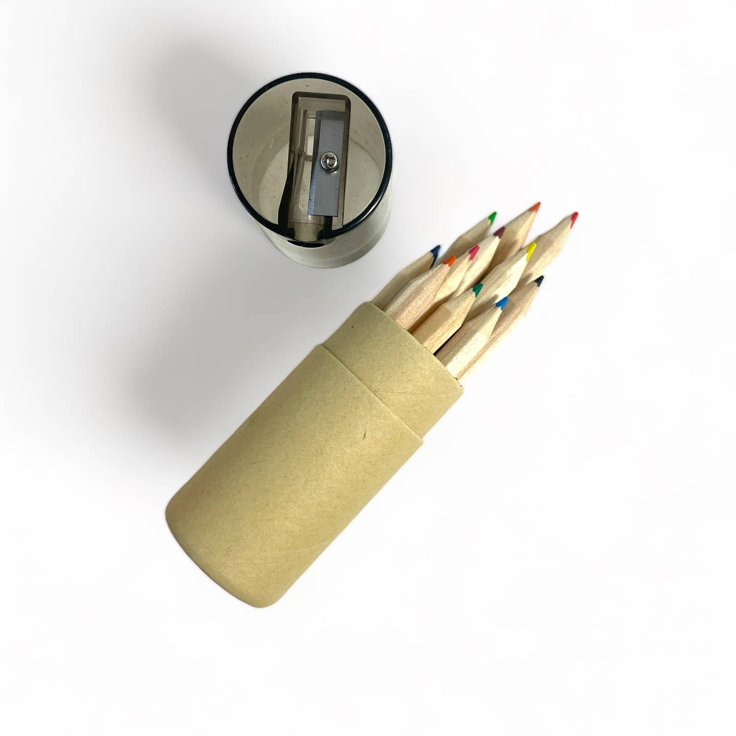 an opened set of mini colored pencils showing the sharpener that is built into the lid