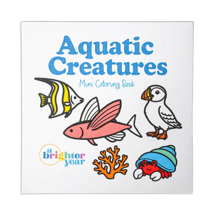 Front cover of the mini coloring book titled 'Aquatic Creatures Muni Coloring Book' on a white background, featuring illustrated sea life including a striped fish, pink fish, puffin, coral, and a hermit crab.