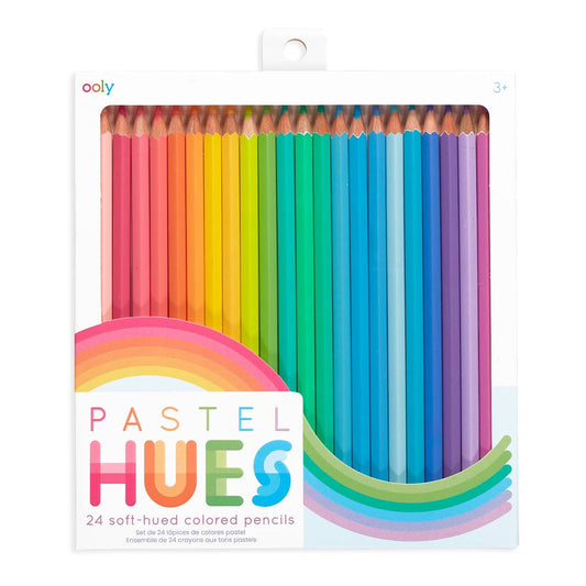 A boxed set of 24 pastel-colored colored pencils by ooly, arranged in a rainbow sequence inside a white retail package with a rainbow graphic and the text 'PASTEL HUES'.