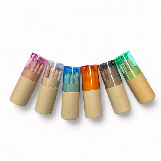 Six sets of the mini travel colored pencils each with a different colored plastic lid, in pink, clear, blue, orange, grey, and green on a white background