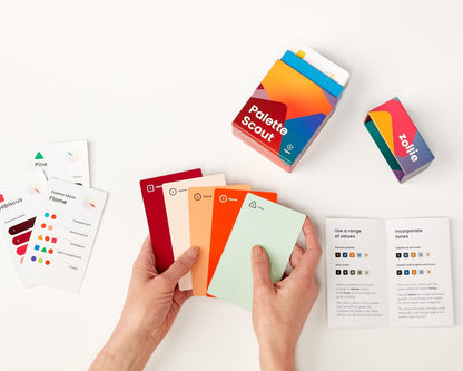 Palette Scout deck laid out with hint cards, instructional booklet, and retail packaging