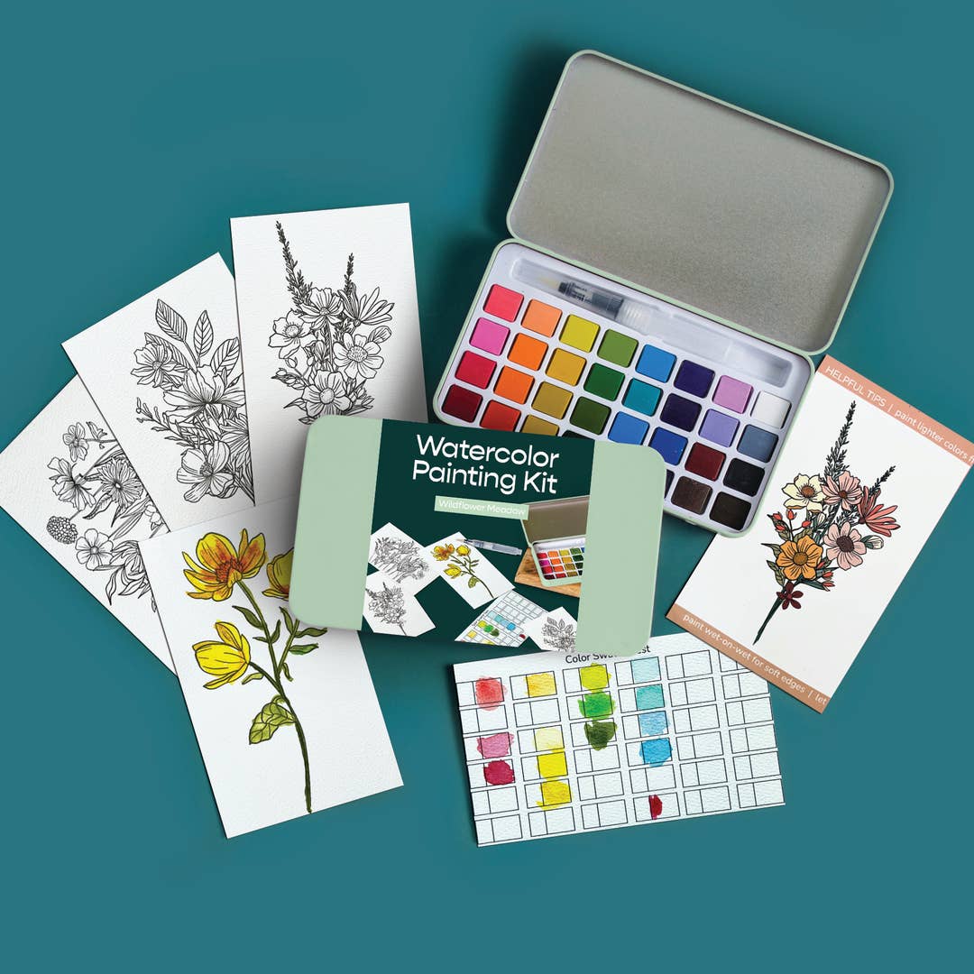 Wildflower Meadows watercolor painting kit with color swatches, cards, and a metal tin on a teal background