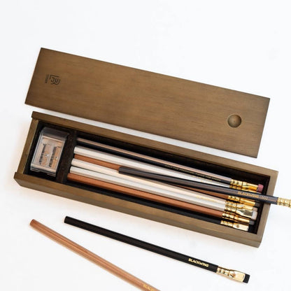 Photo of the Rustic Blackwing box open showing the contents of the four different styles of Blackwing pencils and the 2 step long point sharpener