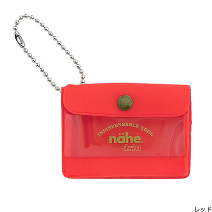 Red keychain pouch with chain and 'nähe' branding on a white background